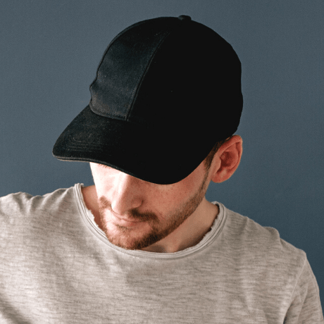 man wearing black cap
