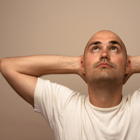 tanning bald man