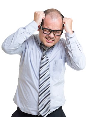 Businessman pulling his hair out